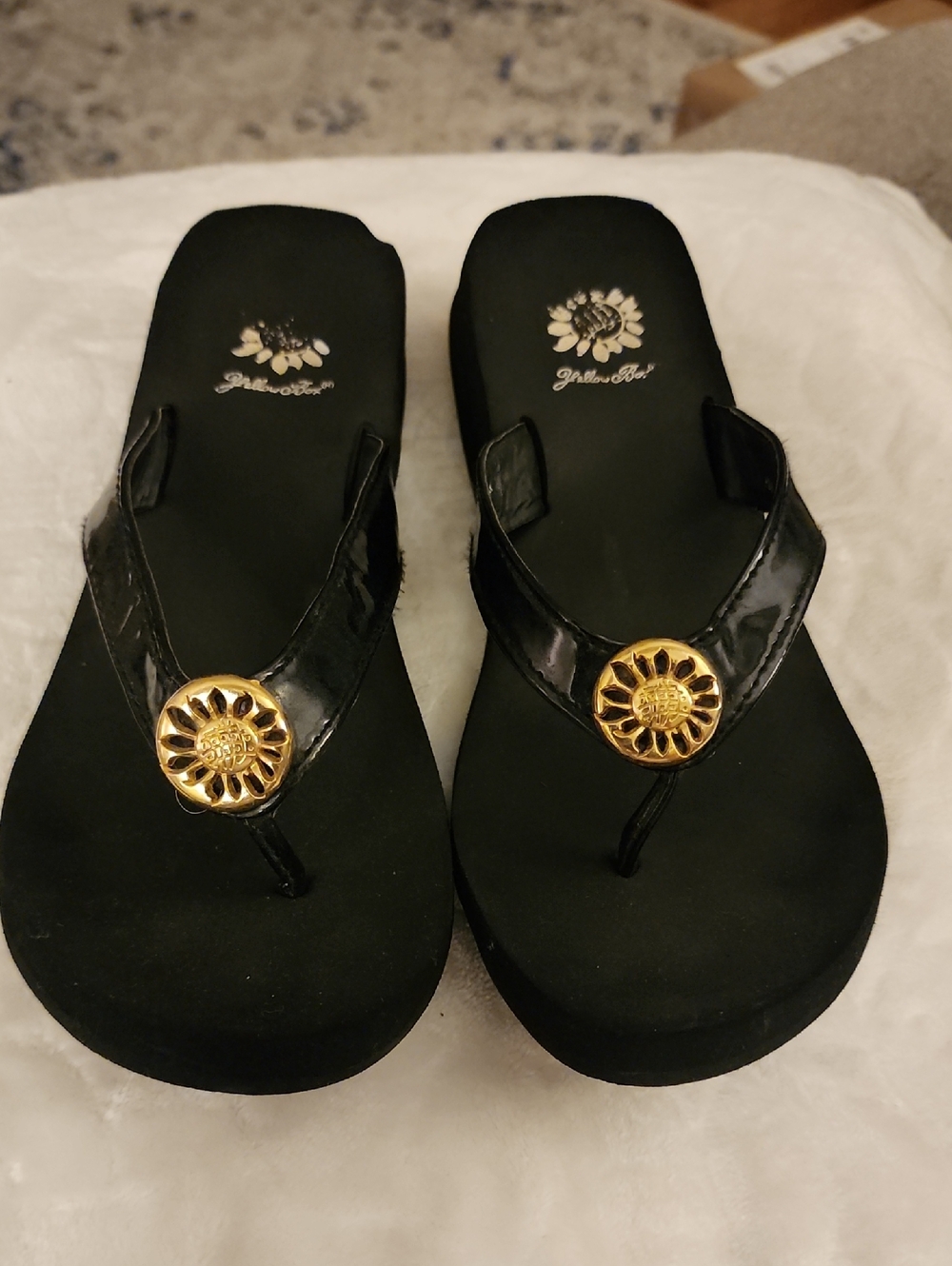 Yellow Box Black Patent Flip Flop Sandals with Gold Sunburst Accent